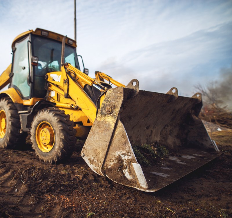 Yellow excavator while cleaning backyard vanceboro nc