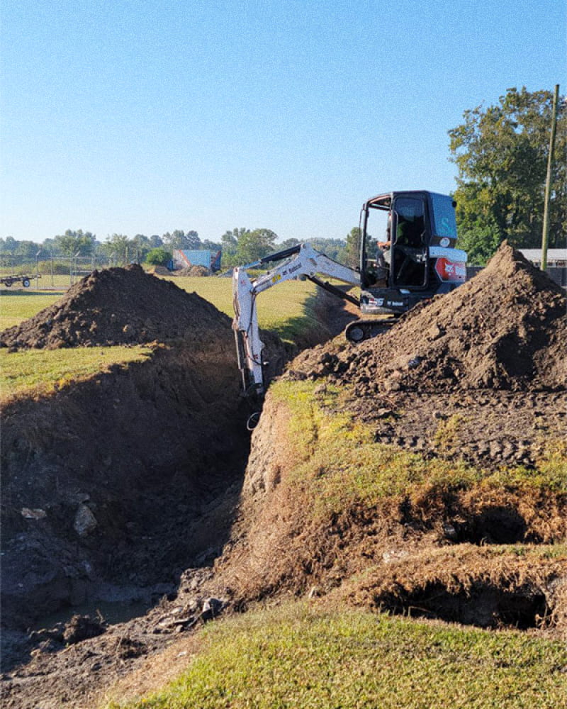 an excavator working on landscape construction vanceboro nc
